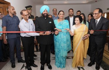 Hon'ble Governor inaugurating the Women's Health Checkup and Cancer Screening Camp by cutting the ribbon.