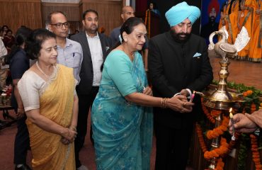 Hon'ble Governor inaugurating the programme organized on women's health checkup and cancer screening camp by lighting the lamp.