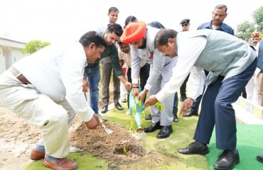 The Hon'ble Governor planting 'Agarwood' plant.