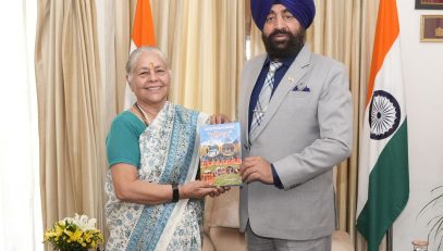 Padma Shri Dr. Madhuri Barthwal presenting her book 'Maangal' - Sanskar Folk Songs of Garhwal' to the Hon'ble Governor.