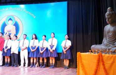 Buddhist nun presenting Buddha Vandana on the occasion of the program.