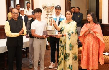 First Lady Mrs. Gurmeet Kaur honoring the overall winner, Mr. Raghav Kalra, of the 19th 