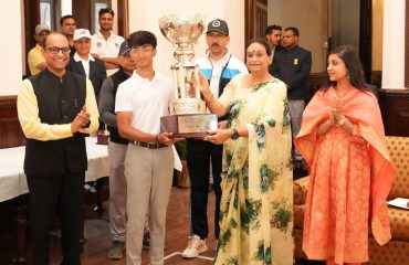 First Lady Mrs. Gurmeet Kaur honoring the overall winner, Mr. Raghav Kalra, of the 19th 