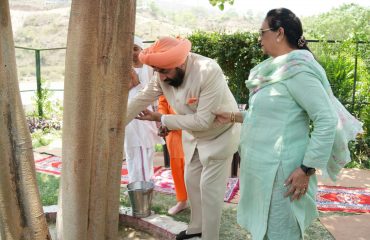 Hon'ble Governor performing Jalabhishek in the Gyan Vriksha (Peepal) situated at Kakrighat, Almora.