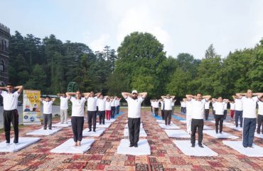 Hon'ble Governor participating in a collective yoga session on the occasion of International Yoga Day.