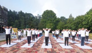 Hon'ble Governor participating in a collective yoga session on the occasion of International Yoga Day.