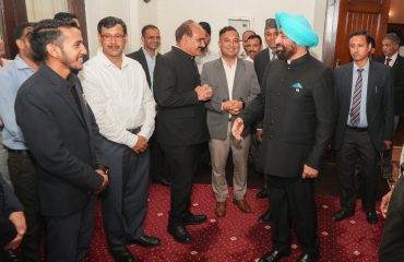 Hon'ble Governor interacting with employees during the Parivar Milan program at Raj Bhawan, Nainital.