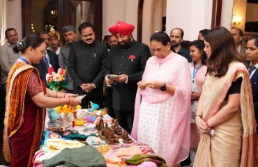 Hon'ble Governor observing the products exhibited by the women from self-help groups.