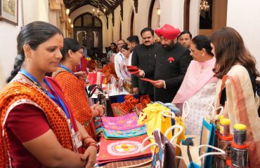Hon'ble Governor observing the products exhibited by the women from self-help groups.