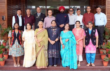 Former soldiers of Assam Regiment and their families with the Hon'ble Governor.