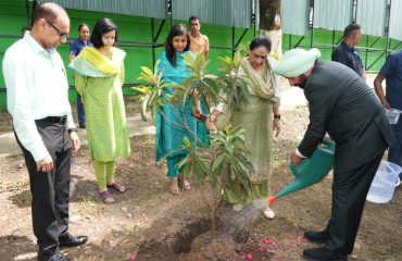 Hon'ble Governor planting a sapling in Raj Bhawan, on the occasion of Harela festival.