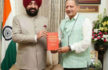 Founder of Valley of Words and retired IAS officer, Dr. Sanjeev Chopra, presenting a book to the Hon'ble Governor.