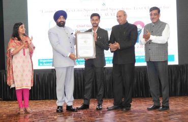 Hon'ble Governor honoring Mayank Bisht, student of Engineering College, Dwarahat Almora, with a certificate of appreciation for developing the AI chatbot.