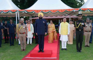 Hon’ble Governor taking the salute of the parade on the occasion of the ‘Hi-Tea’ programme at Raj Bhawan.