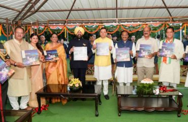 Hon’ble Governor and Chief Minister releasing the coffee table book 