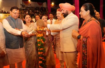 Governor and Chief Minister lighting the lamp at the program organized on the occasion of Shri Krishna Janmashtami at Police Line, Dehradun.