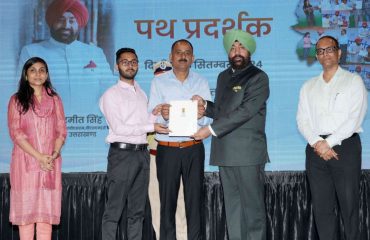 Governor giving scholarships to meritorious students in the “Path Pradarshak” program.