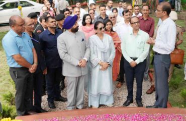 Governor talking to Joint Director Gardens, Dr. Ratan Kumar in the Aromatic Garden in the Raj Bhawan premises.