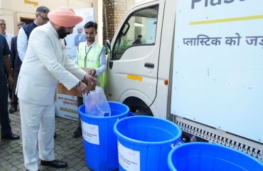 Governor inaugurating the 'Plastic Bank' in the Raj Bhawan campus after the program.