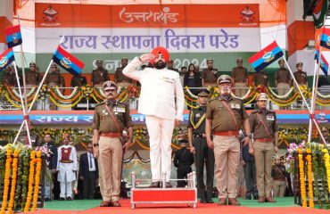 Governor taking salute of the parade in the program organized at Police Line, Dehradun on the occasion of State Foundation Day.