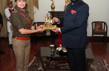 Governor felicitating the parade commanders who led the parade on State Foundation Day.