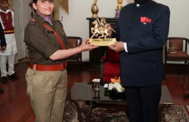 Governor felicitating the parade commanders who led the parade on State Foundation Day.