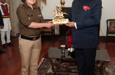 Governor felicitating the parade commanders who led the parade on State Foundation Day.