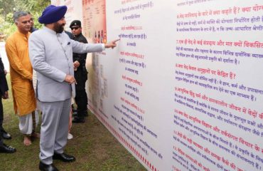 Governor observing the exhibition related to Vedas set up in the premises on the occasion of All India Vedic Conference-2024.