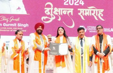 Governor awarding medals and degrees to students at the convocation of Uttaranchal University.