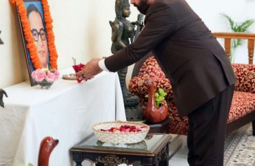 The Governor paying homage to Bharat Ratna Baba Saheb Dr. Bhimrao Ambedkar by laying flowers on his portrait on the occasion of Mahaparinirvan Diwas.