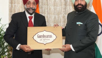 Author Shri BPS Walia presenting his book “Gurudwara of Africa” to the Governor.