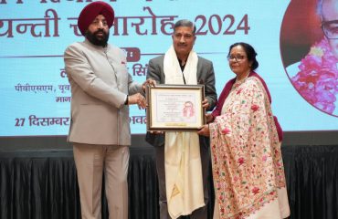 Governor honouring Chief Director, Mohana House, Chakrata, Shri Jaipal Singh Chauhan at the event.