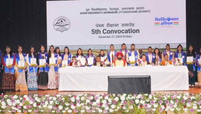 ⁠Governor with students receiving degrees and medals.