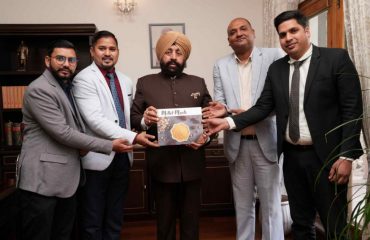 Dean of Hotel Management Department, Devbhoomi University, Dehradun, Shri Chandramouli Dhoundiyal and other teachers presenting their book 