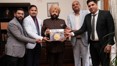 Dean of Hotel Management Department, Devbhoomi University, Dehradun, Shri Chandramouli Dhoundiyal and other teachers presenting their book "Millet Meals" to the Governor.