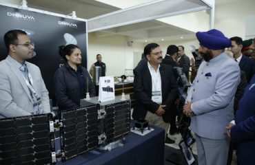 Governor observing the exhibition on the occasion of DefSAT program organized by SIA-India in New Delhi.