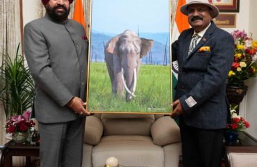 Chief Conservator of Forests, Uttarakhand, Shri Sameer Sinha, paying a courtesy visit to the Governor and presenting him a picture of an elephant.