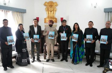 UPSC Chairman Dr. Ravi Dutt Godiyal and other members of the Commission presenting the 23rd annual report of the Commission to the Governor.