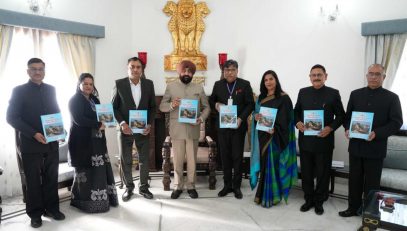 UPSC Chairman Dr. Ravi Dutt Godiyal and other members of the Commission presenting the 23rd annual report of the Commission to the Governor.