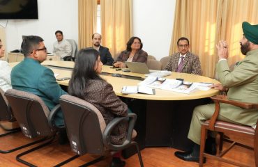 Vice Chancellor of Sridev Suman Uttarakhand University Prof. N.K. Joshi giving a presentation on the progress of research work under the 