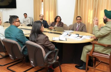 Vice Chancellor of Sridev Suman Uttarakhand University Prof. N.K. Joshi giving a presentation on the progress of research work under the 