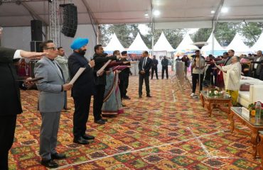 Governor administering the Voter's Day pledge to the people present at the program organized on the occasion of National Voters' Day.