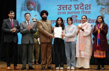 Governor felicitating the girls who scored the highest marks in high school and intermediate examinations at the program.