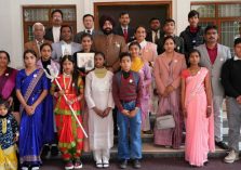 Governor with girl students at the program on the occasion of ‘National Girl Child Day’ and ‘Uttar Pradesh Foundation Day’ at Raj Bhawan.;?>