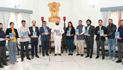 The Governor releasing the book 'Atma Ke Swar' Volume-3 at Raj Bhawan.