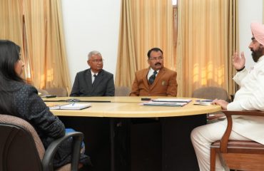 Vice Chancellor of Soban Singh Jeena University Prof. Satpal Singh Bisht giving presentation on the progress of research work under 'One University-One Research' before the Governor.