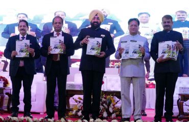 Governor releasing the book at the 17th Agricultural Science Conference of Govind Ballabh Pant Agricultural and Technology University.