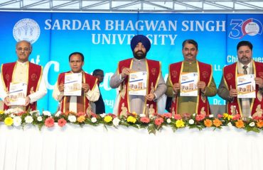 Governor releasing the Annual Report 2023-24 of the University at the first convocation of Sardar Bhagwan Singh University, Dehradun.