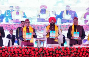 Governor releasing the Progress Report 2023-24 of Uttarakhand Ayurveda University.