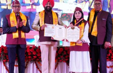 Governor awarding medals and degrees to girl students at the second convocation organized at Rishikul Campus, Haridwar of Uttarakhand Ayurveda University.